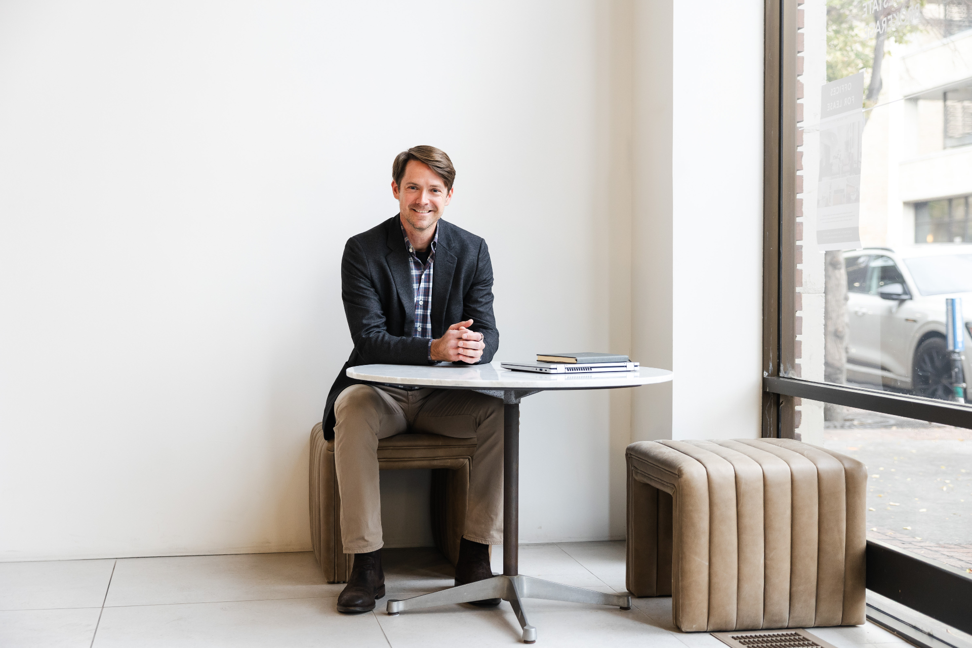 Patten Wood, real estate agent in Greater Ogden, Utah, seated at a cafe table